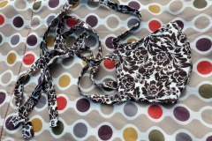 A white and brown paisley sewn facemask with fabric ties